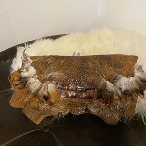 Genuine handmade crocodile and lizard skin clutch bag with natural feathers.